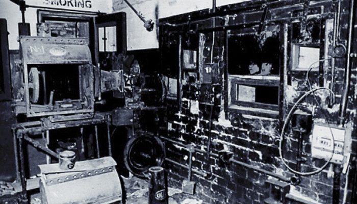 The projection room was vandalised but a lot of equipment was still intact, and old film posters and bits of film lay on the floor. Photo Roy Farthing