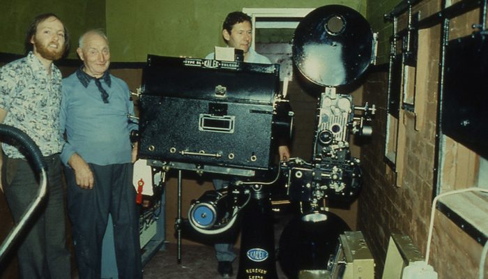 Here is a young David Looser, Ted Butler andPaul Amos in the projection room. In 1981 when the cinema re-opened Kalee Dragons were installed. These came from the Admiralty, where Churchill used to watch the rushes of the war newsreels. The lamps were Vulcan arcs from the local Regent Cinema. Sound was provided by a Kalee model 522 mono valve amplifier. One of these projectors is now at Bletchley park.