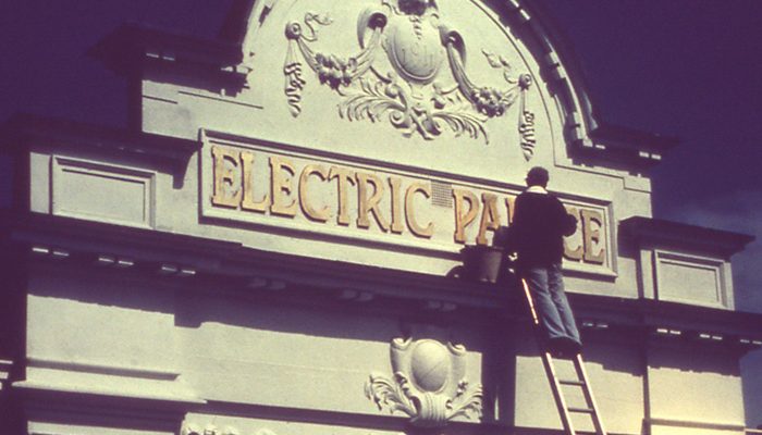 The Electric Place lettering was created by hand in wood at the Harwich School to resemble the original.