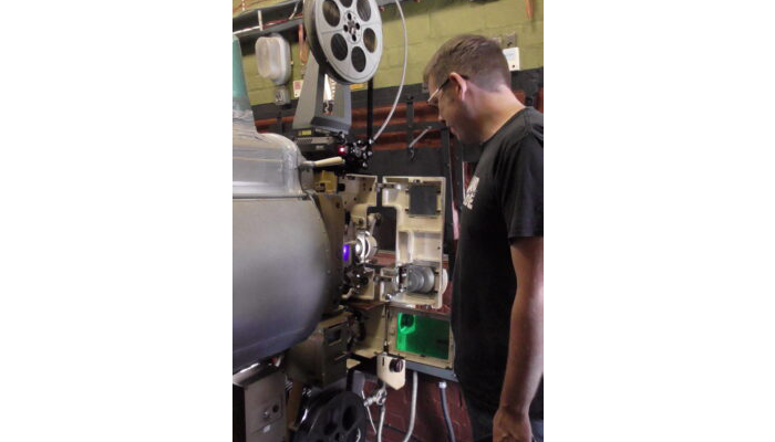 Michael Offord running one of the Kalee 20 film projectors in 2022.